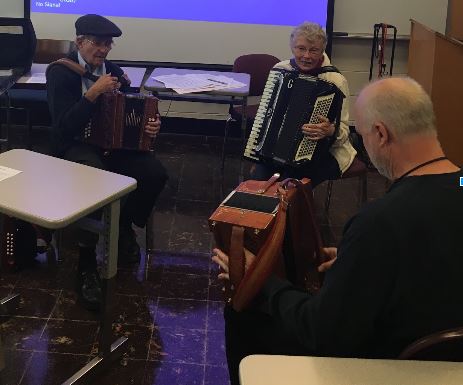 Ted McGraw and Jane Sturmer conduct a workshop in button accordion playing. (Photo by Lauren Welling, staff photographer.)