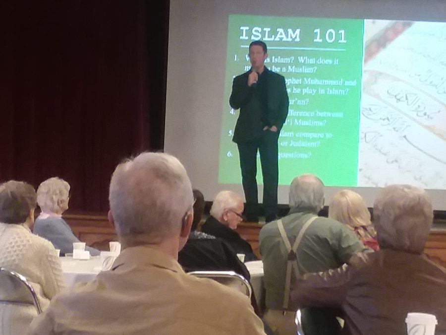 Dr.+Rob+Dunbar+of+the+Religious+Studies+Department+describes+the+basics+of+Islam+for+a+First+Friday+audience.