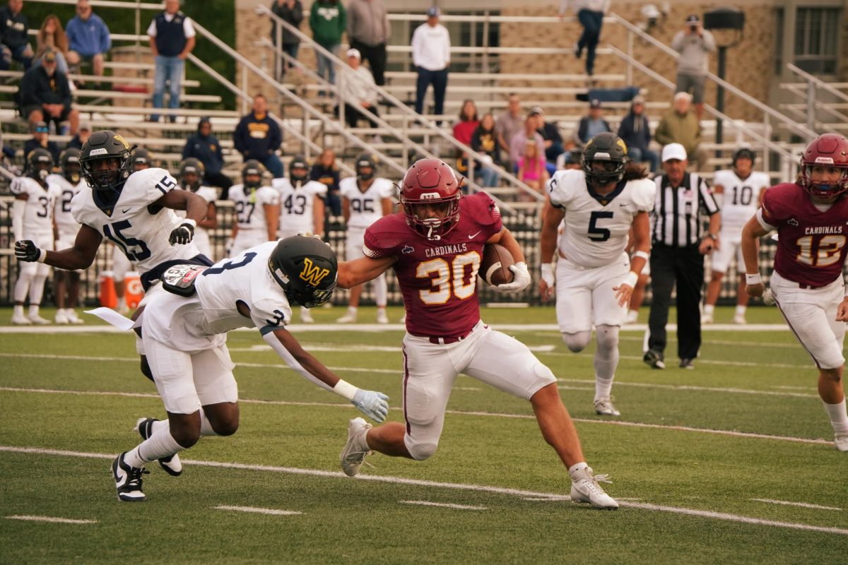 Peyton Nolan avoids the tackle (Photo taken by Nicole Pomerleau @frames_by_nicole)