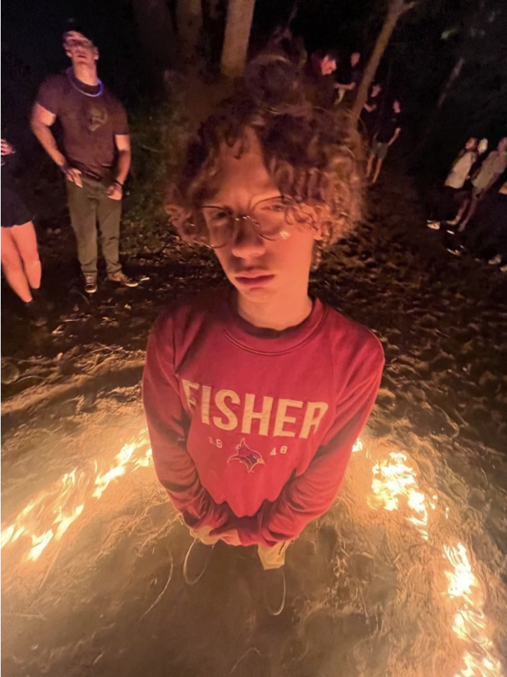 Jack Lewis stands inside a ring of fire. (Photo provided by Jack Lewis)