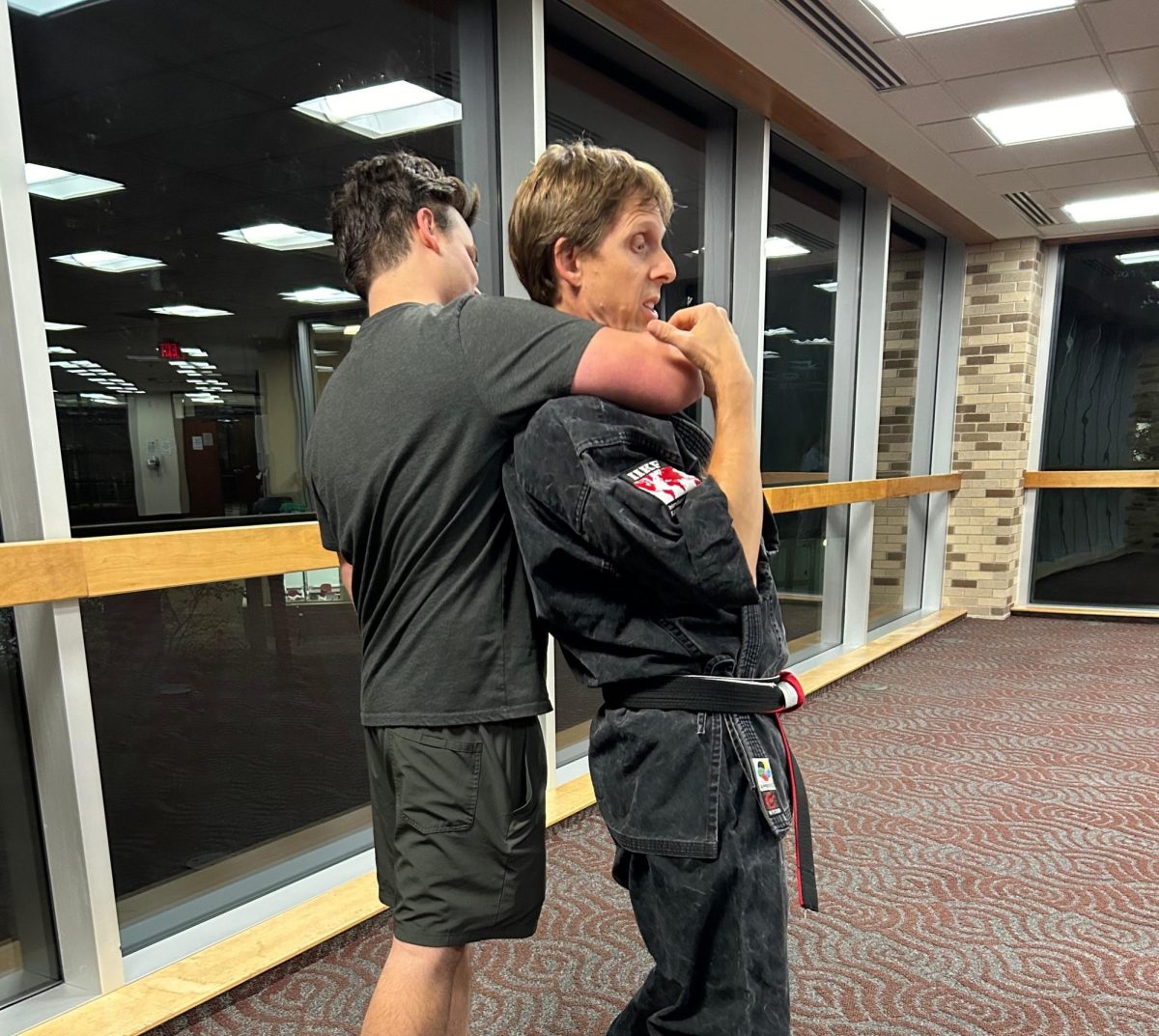 A student practices self-defense skills.