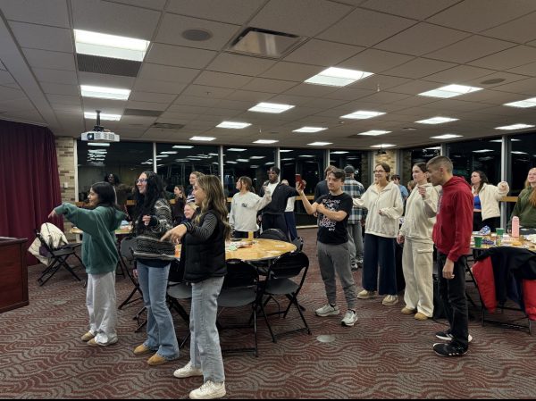 Members of Fisher’s Best Buddies program dance as part of the group’s Thanksgiving gathering.