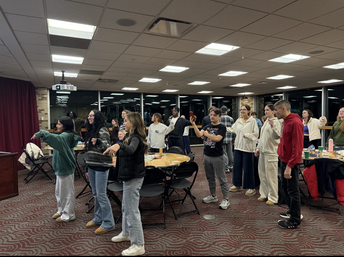 Members of Fisher’s Best Buddies program dance as part of the group’s Thanksgiving gathering.