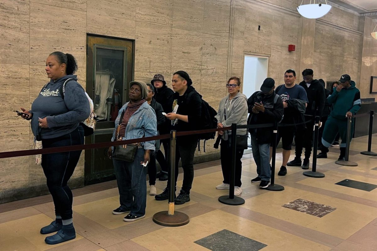 People wait in line outside the city’s vital records office in Lower Manhattan, May 5, 2025. 