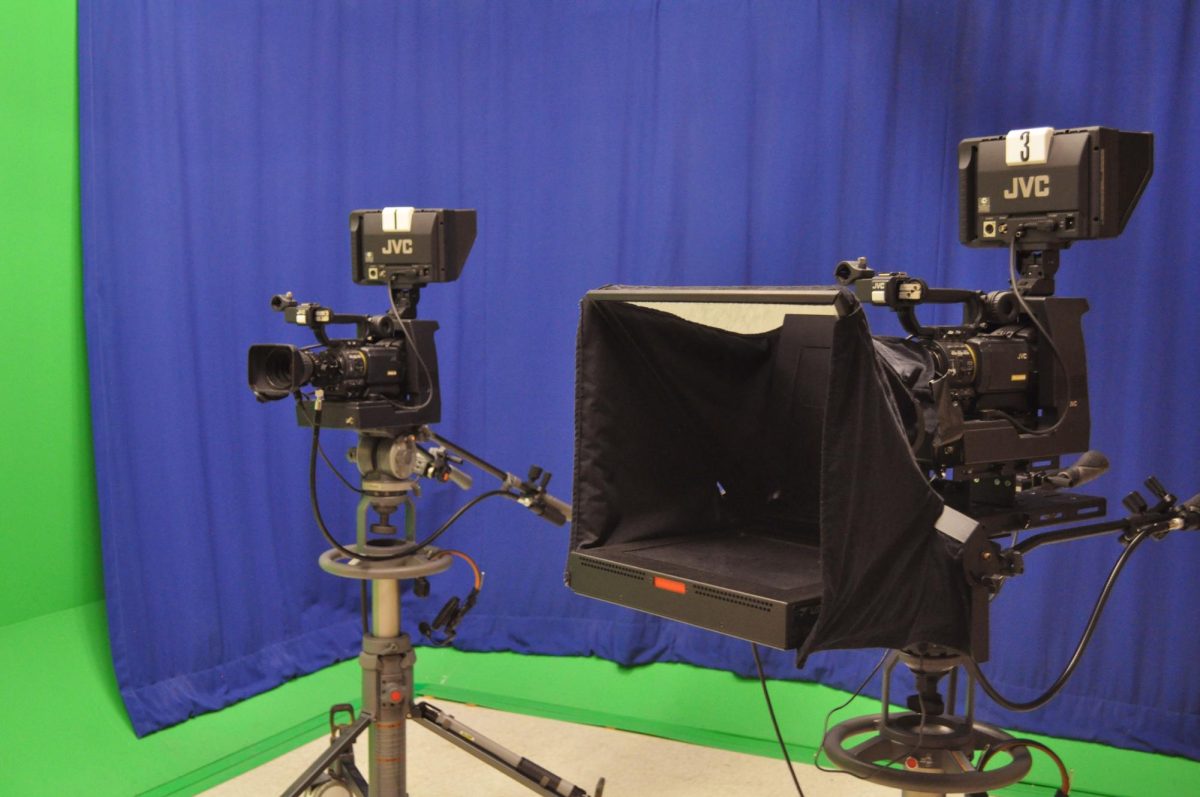 (Above) Cameras and blue and green screens for filming.