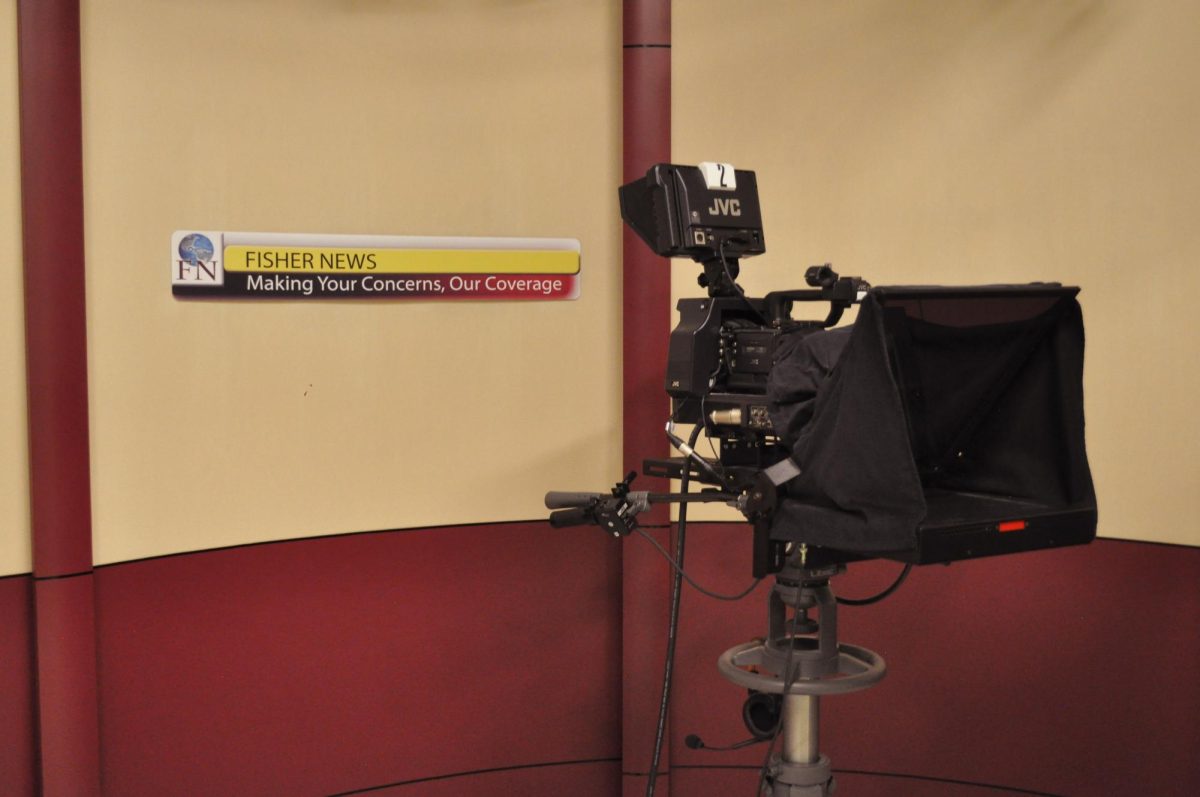 (Above) Camera equipment and Fisher News backdrop.