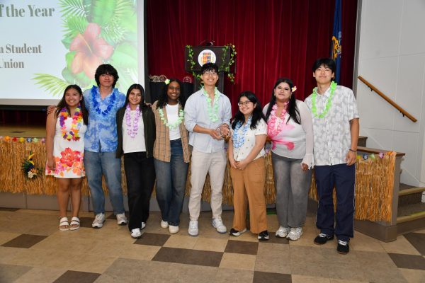(Left to right) Mikhayla Reyes, JR Velasco, Azka Tasneem, Dominique Lawrence, Jason Wang, Sophia Smith, Tehreen Shah and Jiwon Kang, members of the Asian Student Union, pose after receiving the Club of the Year award at the Cardinal Awards on April 8.