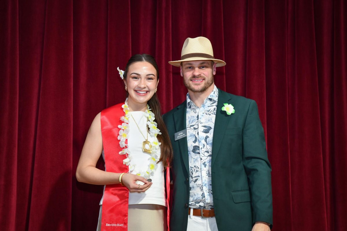 Leah Kucharshi, a two-year SGA senator, poses with Chris Keyes, director of Student Engagement and Leadership, at the Cardinal Awards on April 8.